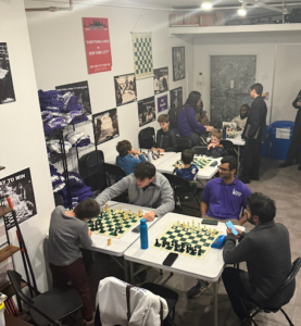 Guests enjoying a chess-themed birthday celebration